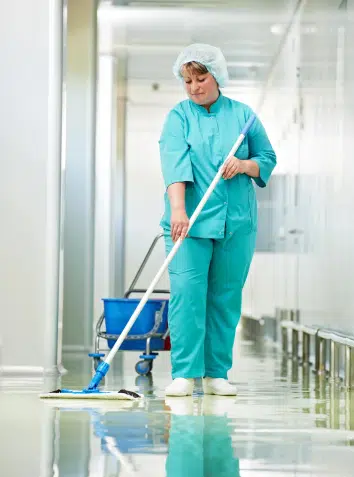 Medical office cleaners mopping a clinic floor with antiseptic technique. Doctor's offices and hospitals can benefit from daily medical facility cleaning in NYC, medical office cleaning nyc.